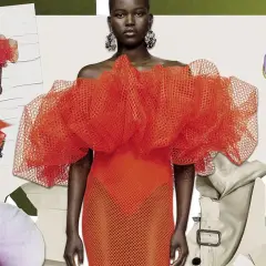 Un desfile de moda con un vestido naranja voluminoso, orquídeas y un imperdible con flor. El derecho de la moda inspira estas creaciones.