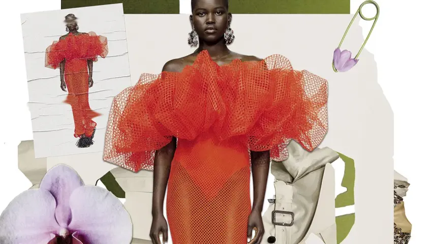 Un desfile de moda con un vestido naranja voluminoso, orquídeas y un imperdible con flor. El derecho de la moda inspira estas creaciones.
