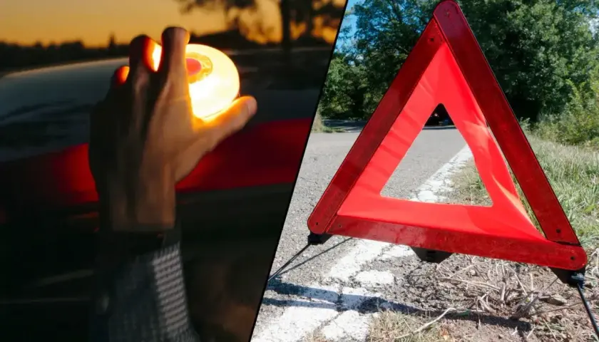 Mano sostiene luz de emergencia, junto a un triangulo virtual v27 en la carretera.