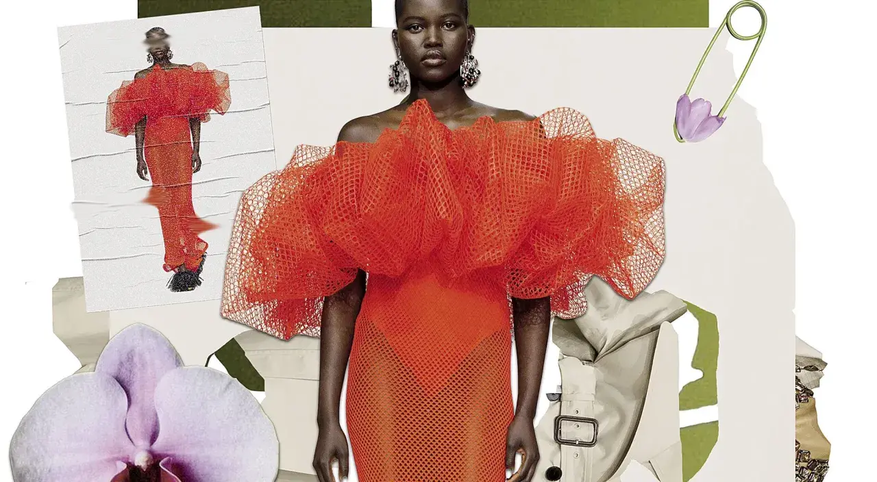Un desfile de moda con un vestido naranja voluminoso, orquídeas y un imperdible con flor. El derecho de la moda inspira estas creaciones.