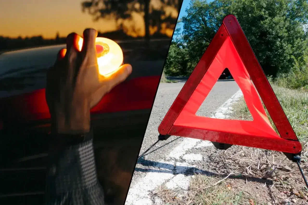 Mano sostiene luz de emergencia, junto a un triangulo virtual v27 en la carretera.